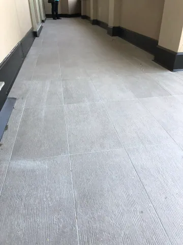 Tile flooring along a covered balcony