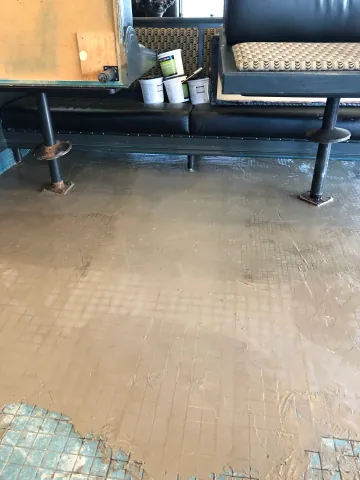 Commercial seating area during floor preparation