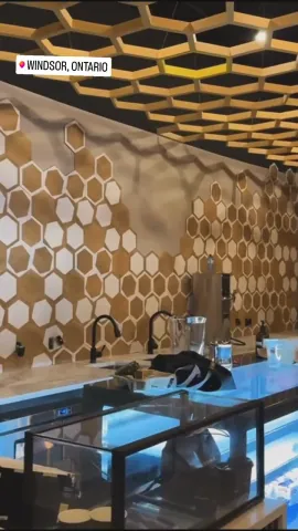 Honeycomb wall tiles and geometric ceiling details during commercial fit-out