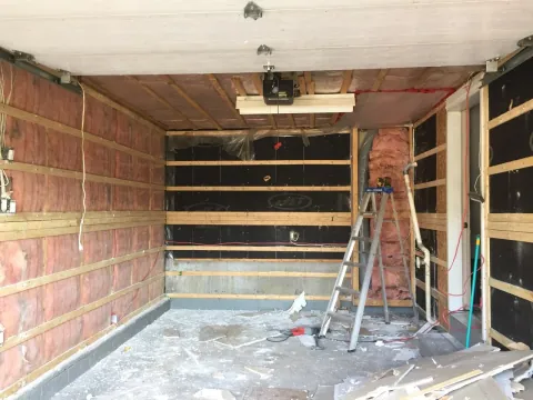 Garage wall insulation and framing before drywall