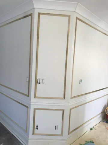 Decorative wall panelling during interior finishing