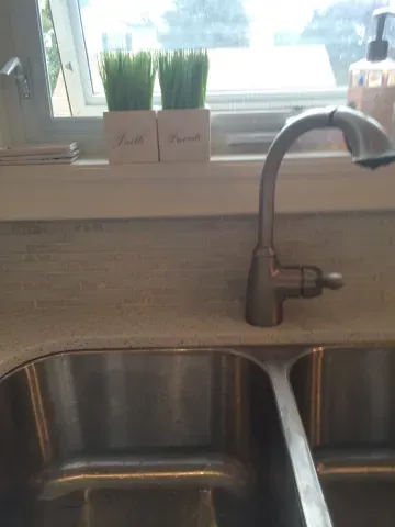 Stainless-steel sink and kitchen tile detail