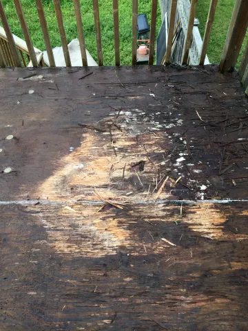 Weathered deck boards before surface preparation