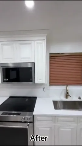 White kitchen cabinets and stainless-steel appliances